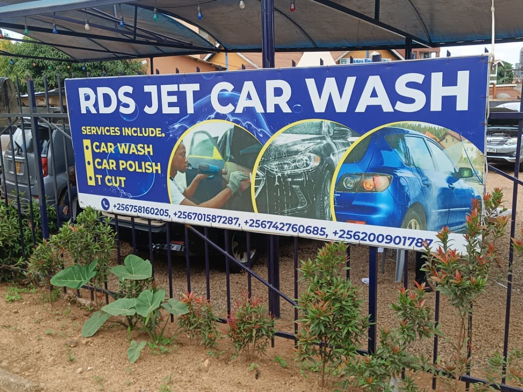 Blue banner for RDS Jet Car Wash advertising car wash, polish, and T-cut services.